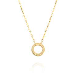 A solid 14k gold necklace featuring a paperclip link chain and a circular pendant with intricate engraved details. The polished gold chain measures 50mm in length, adding a modern yet timeless elegance to the design.