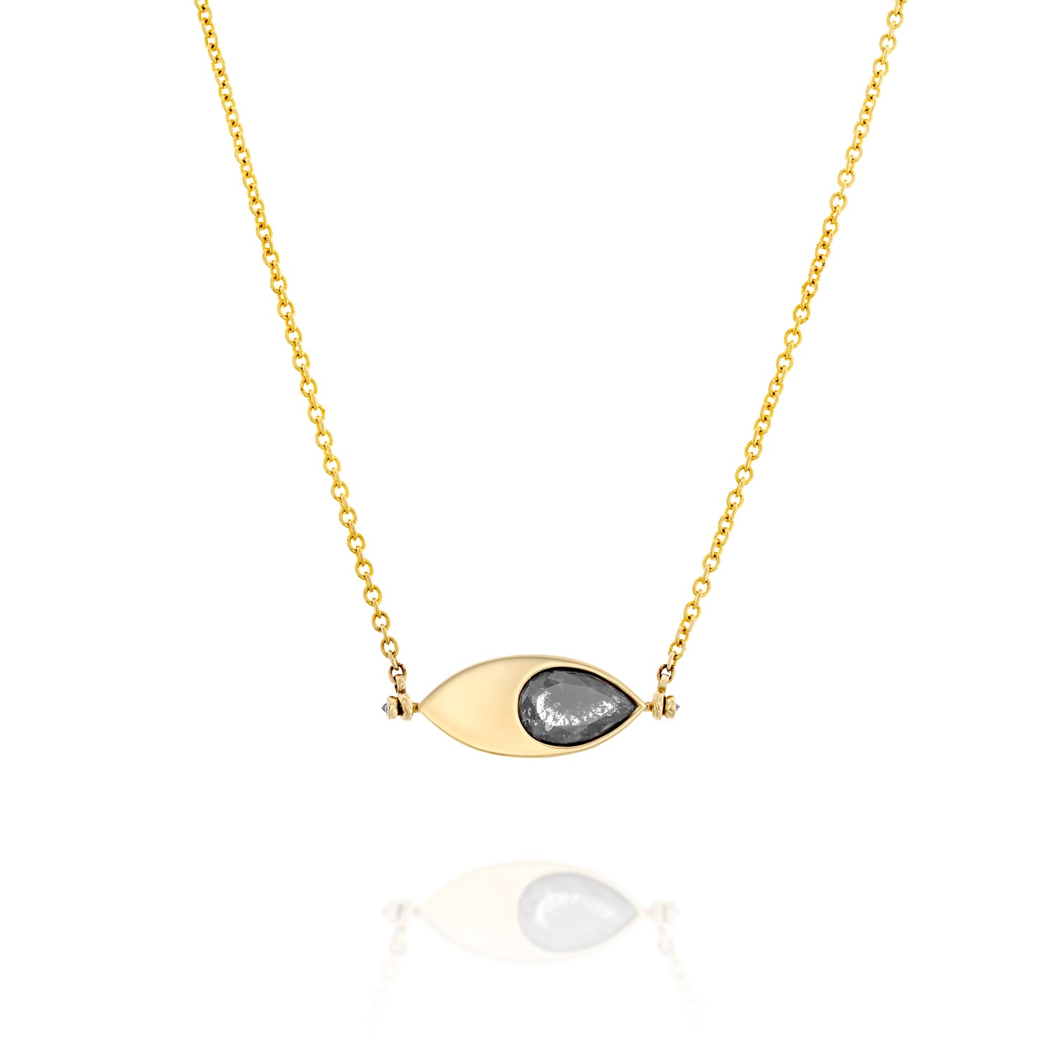 A solid 14k gold pendant necklace featuring a 1.64-carat pear-cut natural salt-and-pepper diamond set in an eye-shaped bezel. The design includes two 1.5mm round white diamonds and a 50mm rolo chain. The unique salt-and-pepper diamond showcases natural inclusions, making this piece one-of-a-kind.