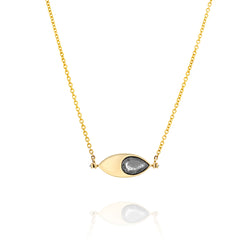 A solid 14k gold pendant necklace featuring a 1.64-carat pear-cut natural salt-and-pepper diamond set in an eye-shaped bezel. The design includes two 1.5mm round white diamonds and a 50mm rolo chain. The unique salt-and-pepper diamond showcases natural inclusions, making this piece one-of-a-kind.