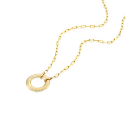 A solid 14k gold necklace featuring a paperclip link chain and a circular pendant with intricate engraved details. The polished gold chain measures 50mm in length, adding a modern yet timeless elegance to the design.