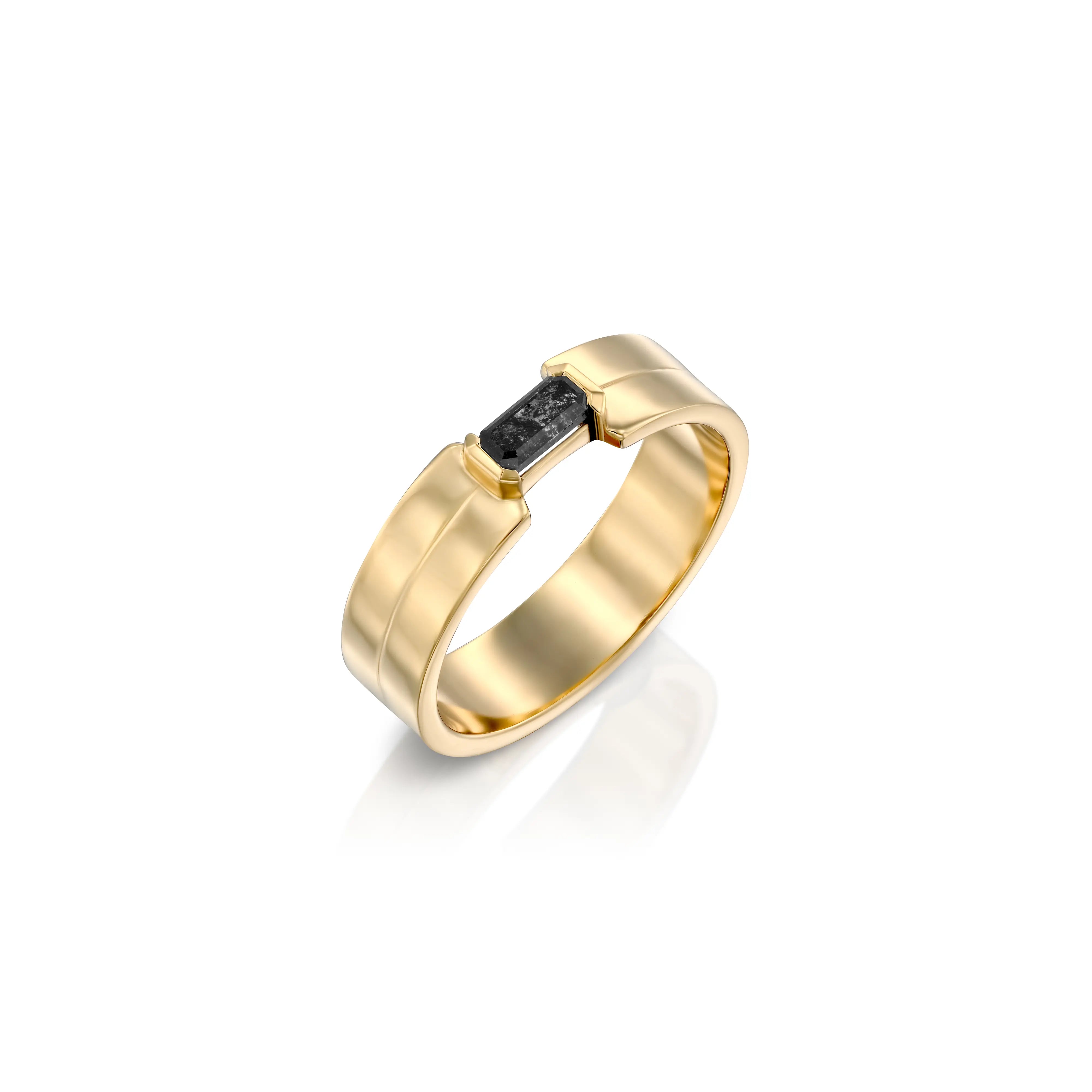 A solid 14k gold Buckle Band ring featuring a 0.24-carat elongated emerald-cut salt-and-pepper diamond. The polished gold band measures 5mm in width and showcases bold, architectural design details. The unique diamond displays natural inclusions and color variations, making each piece one-of-a-kind