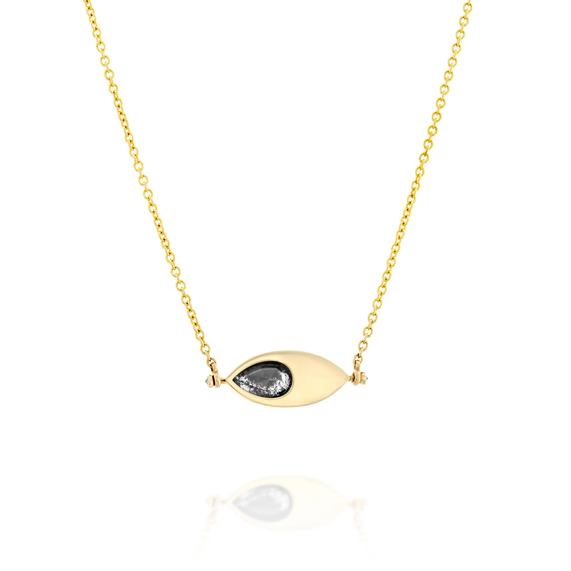 A solid 14k gold pendant necklace featuring a 1.64-carat pear-cut natural salt-and-pepper diamond set in an eye-shaped bezel. The design includes two 1.5mm round white diamonds and a 50mm rolo chain. The unique salt-and-pepper diamond showcases natural inclusions, making this piece one-of-a-kind.