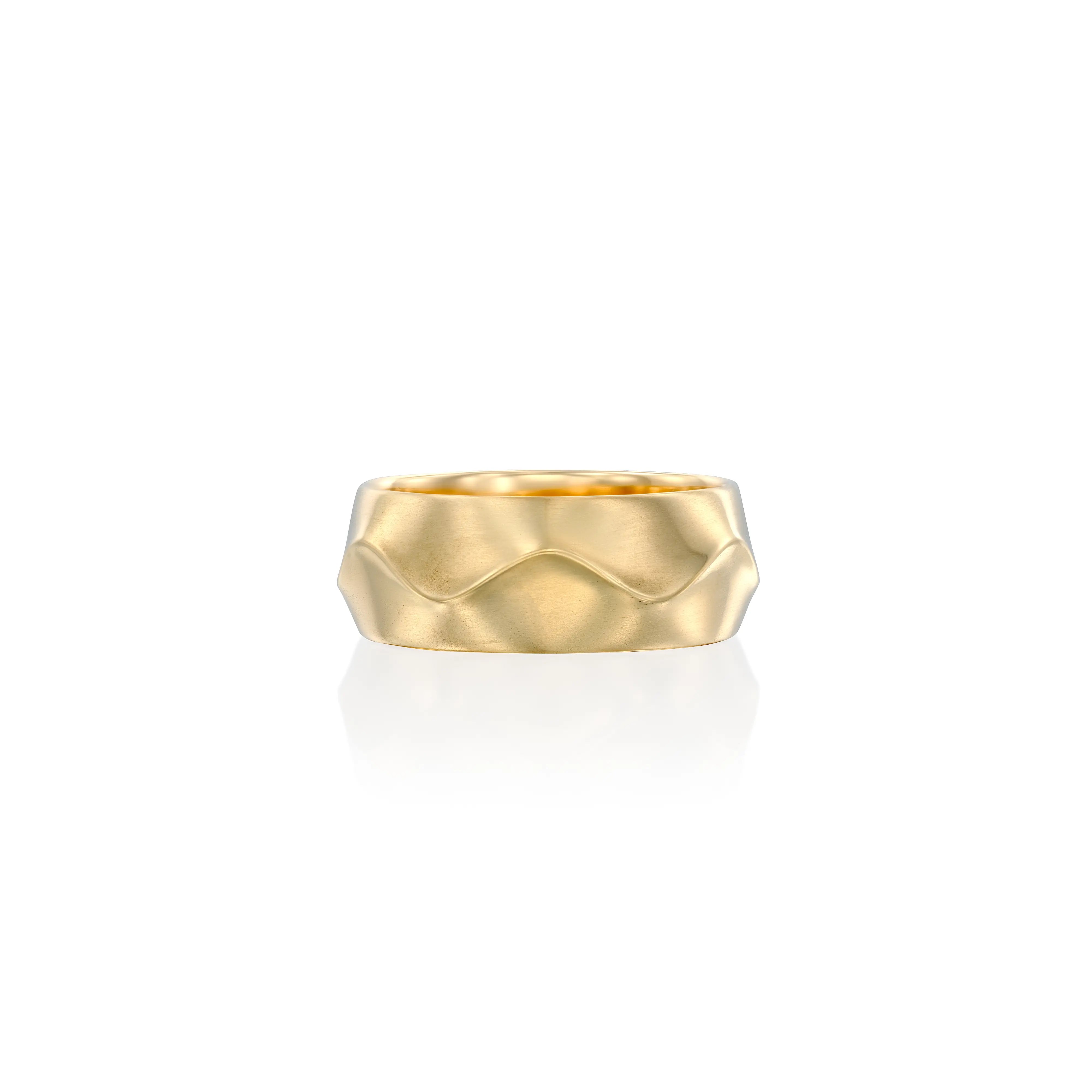 Solid 14k gold ring with a bold, wavy ruffle design, featuring a matte finish that highlights its sculptural form. A statement piece blending elegance and modern artistry.