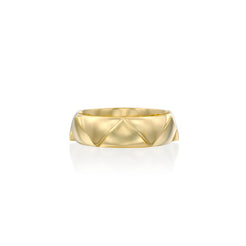 Solid 14k gold ring with a striking crown-inspired design, featuring a 5.7mm band width. Its sculptural geometry adds a bold yet refined touch.