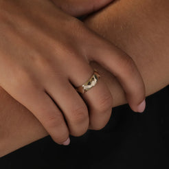 A golden crown for your hand, symbolizing your reign over your own world. Photographed in solid 14k gold, this 5.7mm ring embodies bold elegance and self-empowerment.