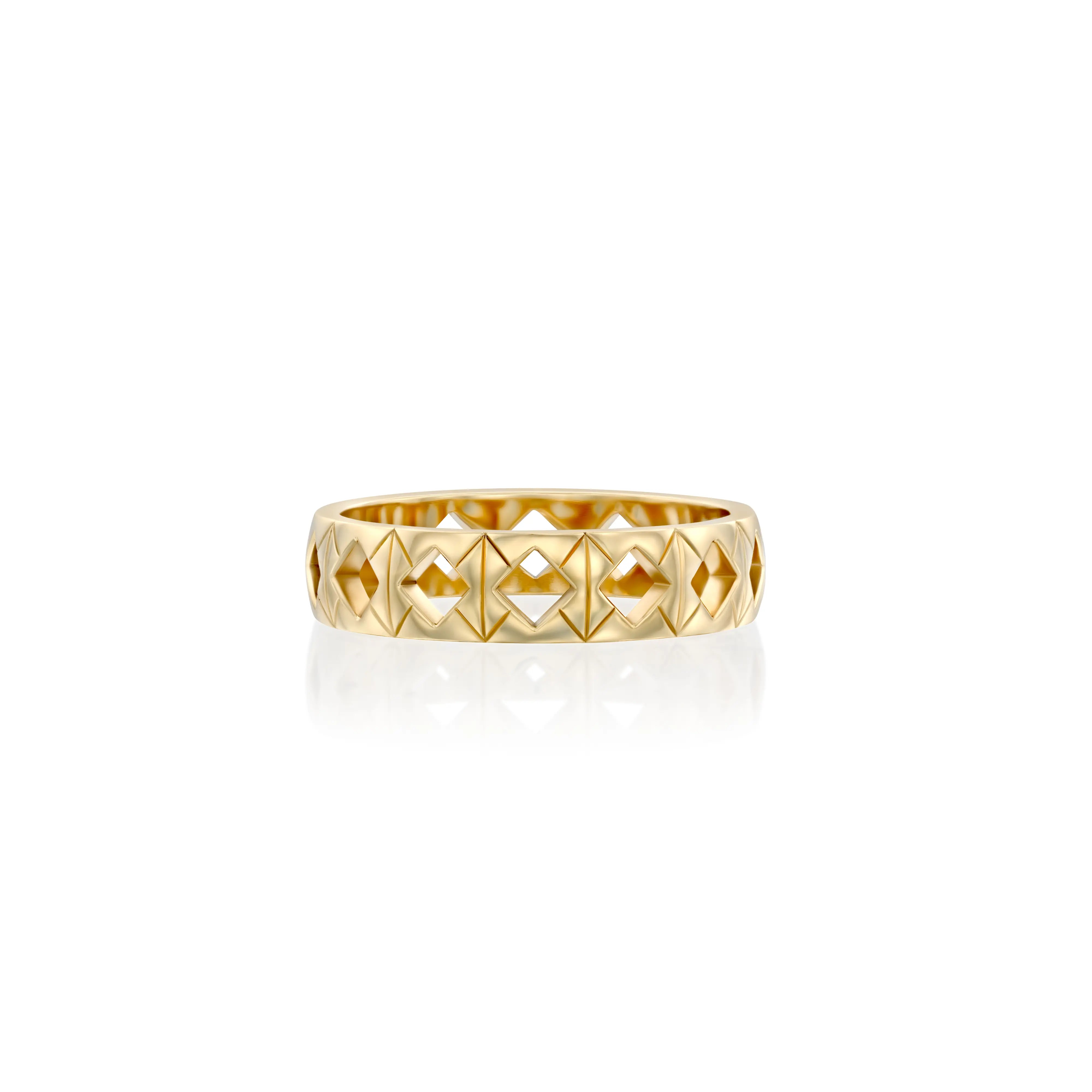 Solid 14k gold ring with a distinctive geometric pattern of engravings and recessed diamond-shaped tile cut-outs. Band width: 5mm. A bold yet refined design for any occasion