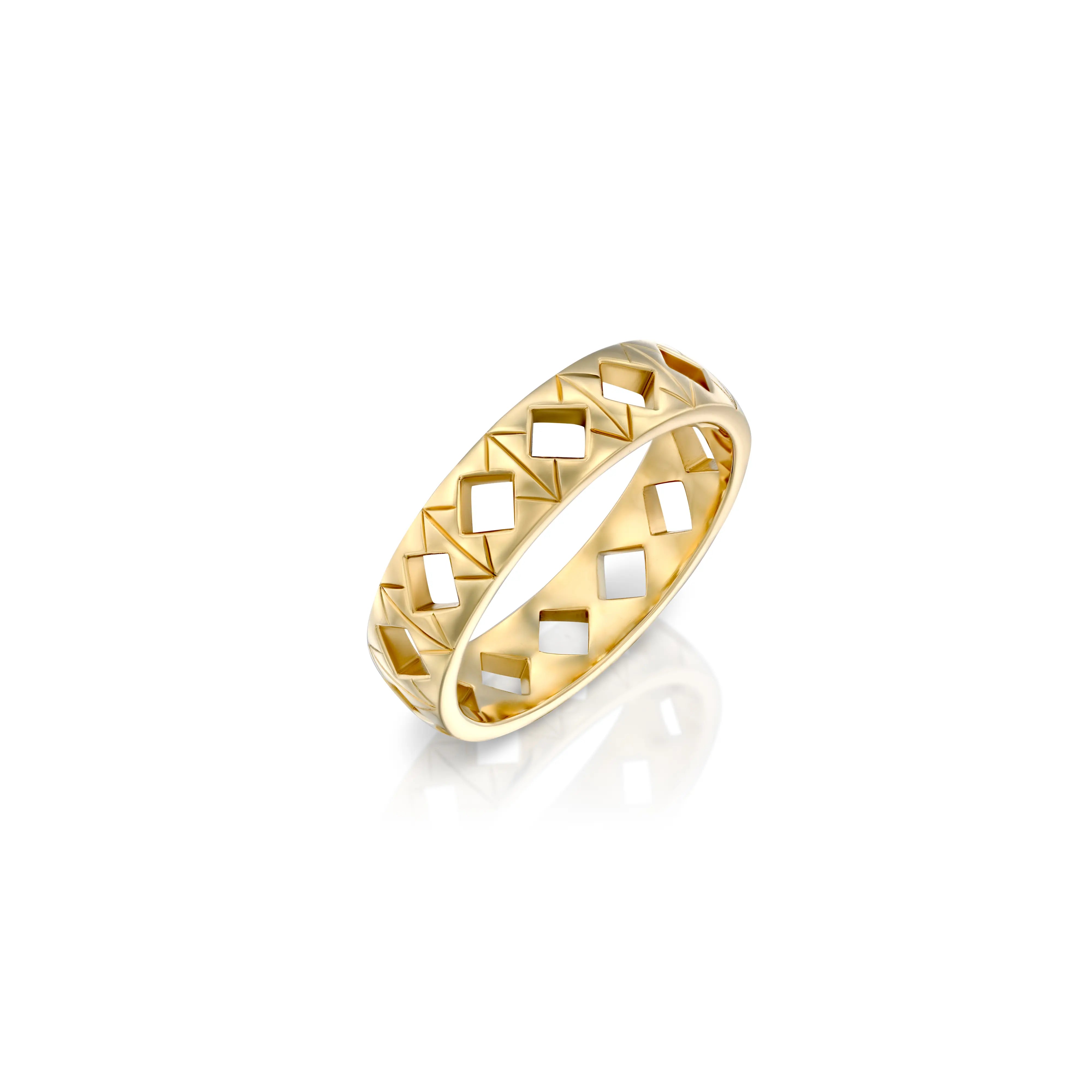 Solid 14k gold ring with a distinctive geometric pattern of engravings and recessed diamond-shaped tile cut-outs. Band width: 5mm. A bold yet refined design for any occasion. 