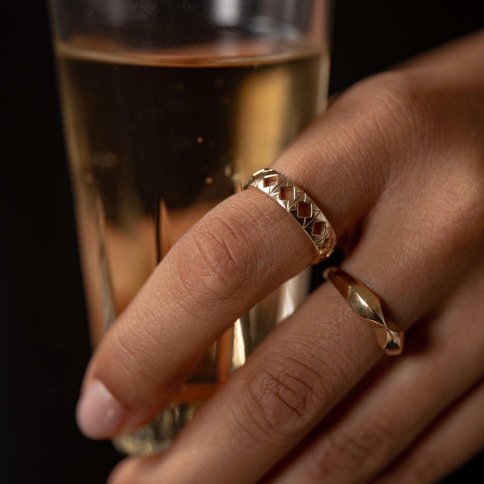 Hand modeling the Tiling Ring, featuring sharp engraved lines and negative spaces that create a perfect blend of vintage charm and modern flair. Photographed in solid 14k gold. Band width: 5mm.